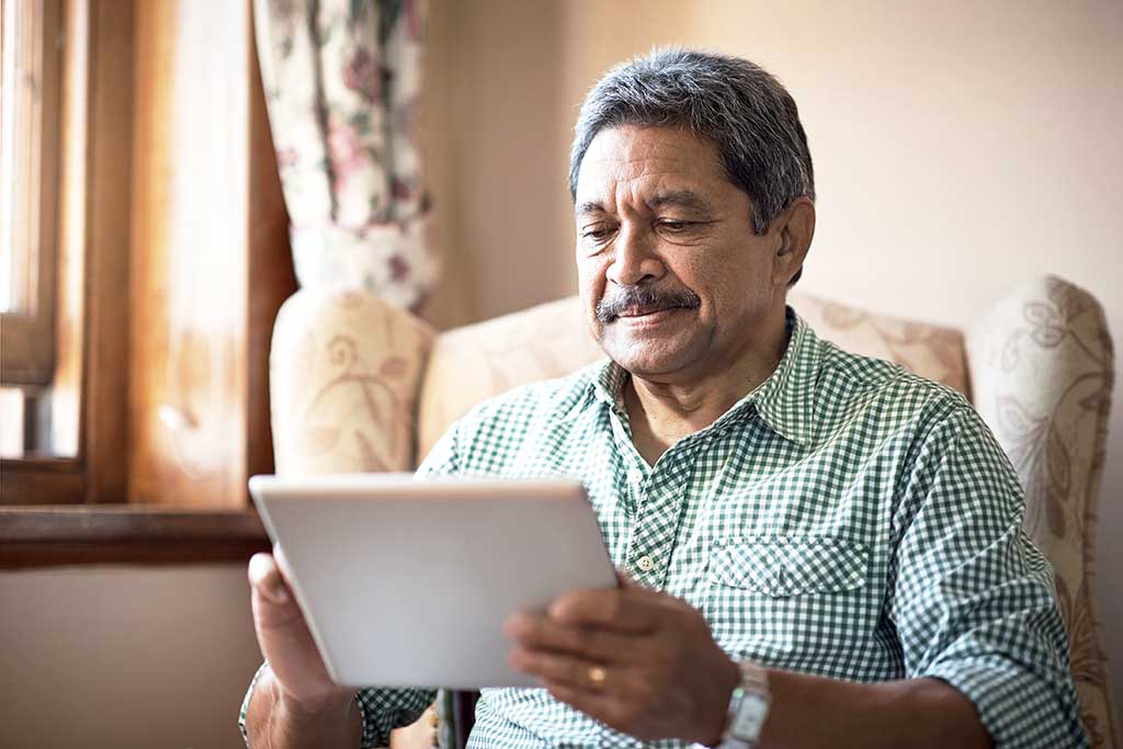 senior man using a tablet