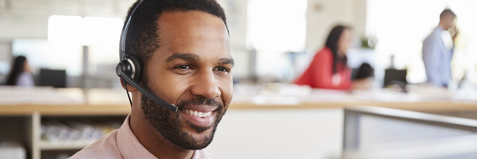 man in a call center on a headset